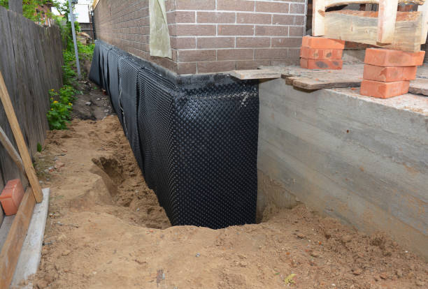 Happy homeowners after waterproofing job in Montvale